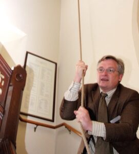 Duty warden Till Heyde tolls the bell at Christ Church Cathedral Ottawa 22 times, marking the church’s #22days campaign for healing and reconciliation. Photo: Art Babych