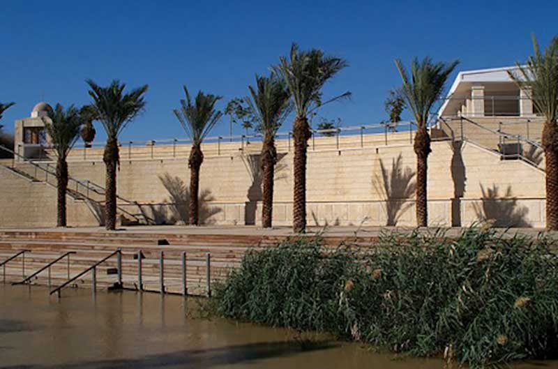 The baptism site at Qasr-al-Yahud, on the West Bank of the River Jordan, photographed from the baptism site at Al-Maghtas, on the Jordanian side. The site was re-opened in 2011 but access to the nearby churches remained out of bounds because of the existence of around 4,000 mines. Photo: Wikimedia / High Contrast