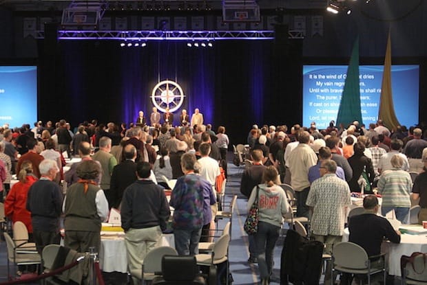 Members pray before the start of a session at General Synod 2010 in Halifax. File Photo: Art Babych/Anglican Journal